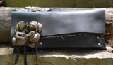 Black evening bag with leather flower