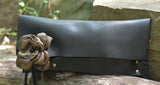 Black evening bag with leather flower