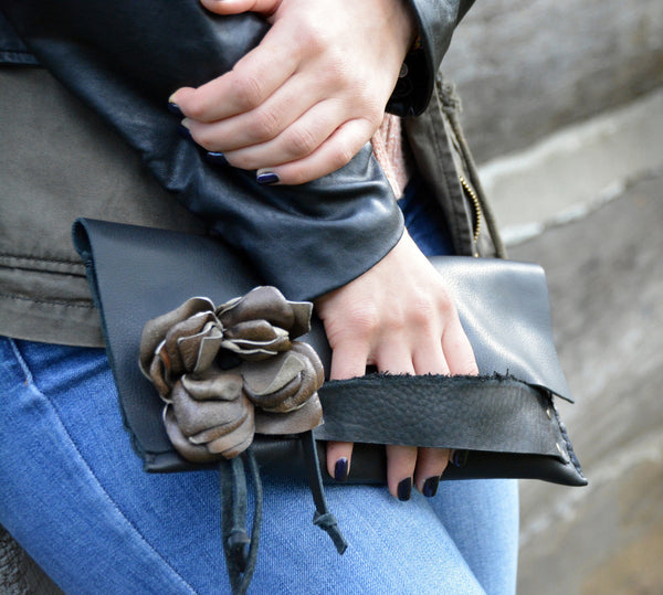 Black evening bag with leather flower