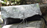 Silver metallic cowhide and Black leather clutch