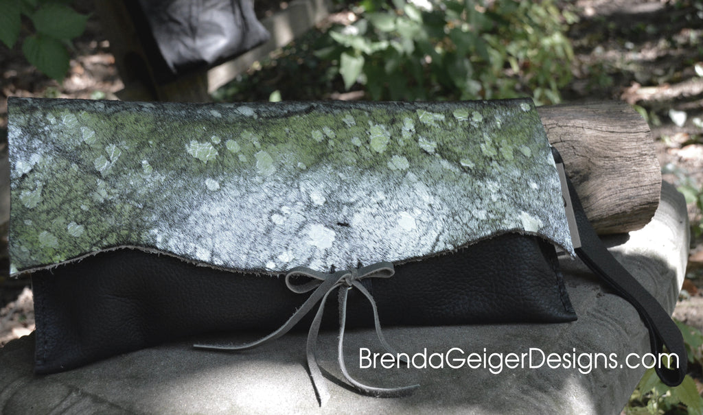 Silver metallic cowhide and Black leather clutch